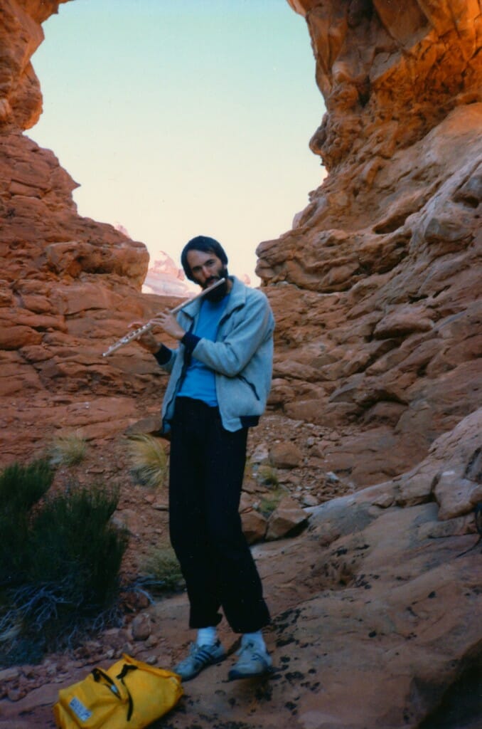 Steven Roberts playing flute in Arches National Park