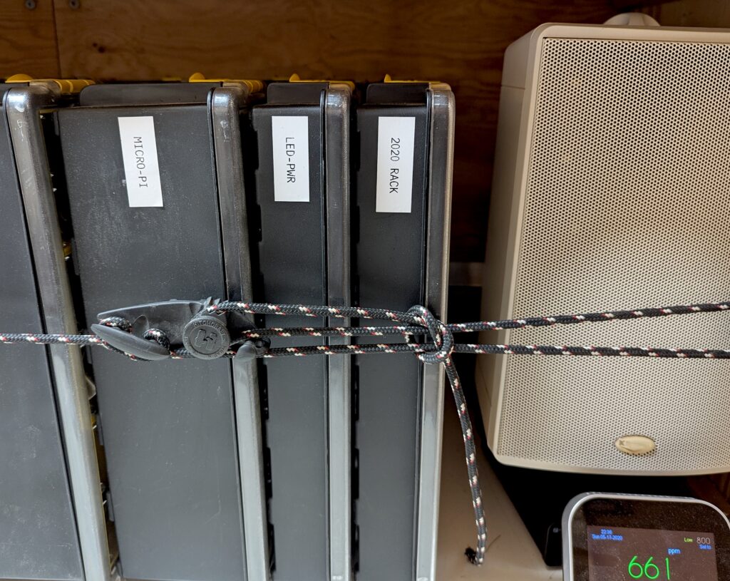 Hitchcraft rope tie retaining Stanley parts boxes in mobile lab