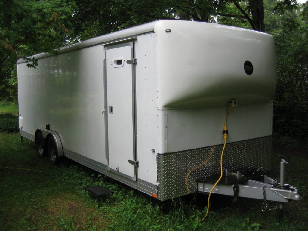 Wells-Cargo EW-2424 trailer being used as mobile laboratory, exterior view in Camano Island woods